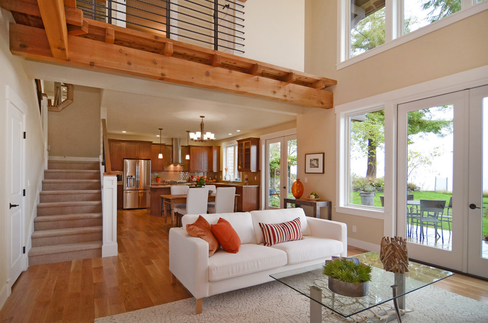 Inspiration for a large craftsman open concept light wood floor living room remodel in Seattle with beige walls, a standard fireplace and a stone fireplace