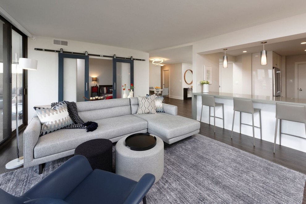 Идея дизайна: парадная, изолированная гостиная комната среднего размера в современном стиле с белыми стенами и темным паркетным полом без камина, телевизора