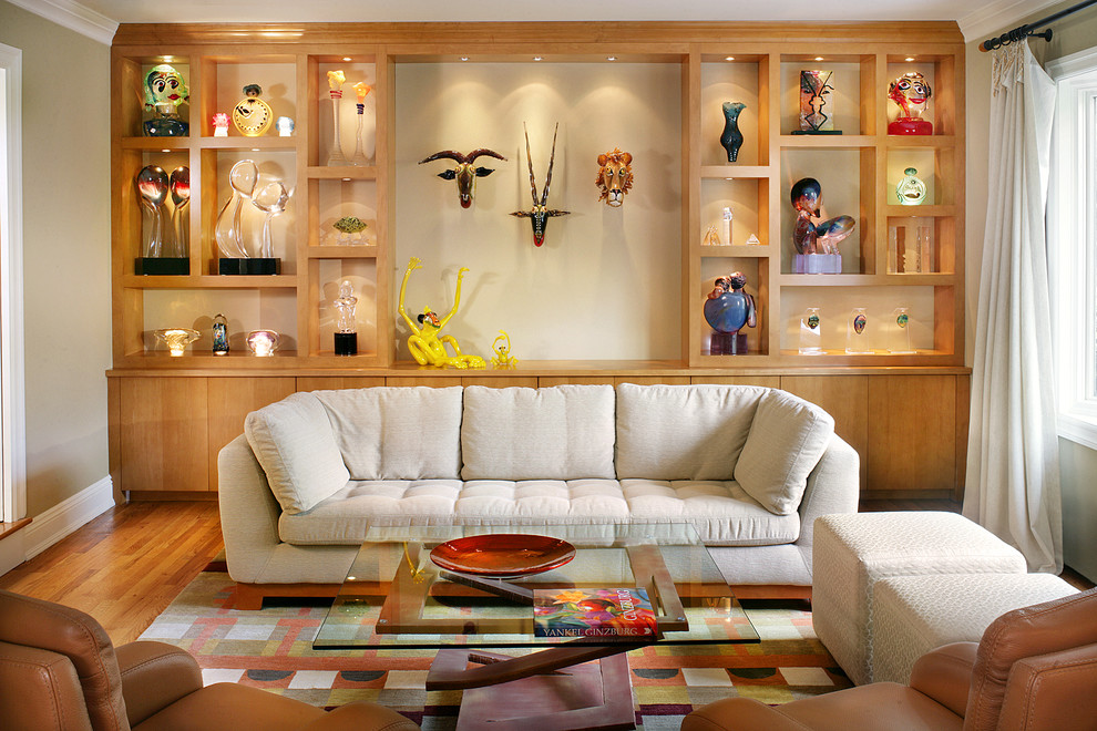 Example of a mid-sized eclectic formal and enclosed medium tone wood floor living room design in New York with beige walls