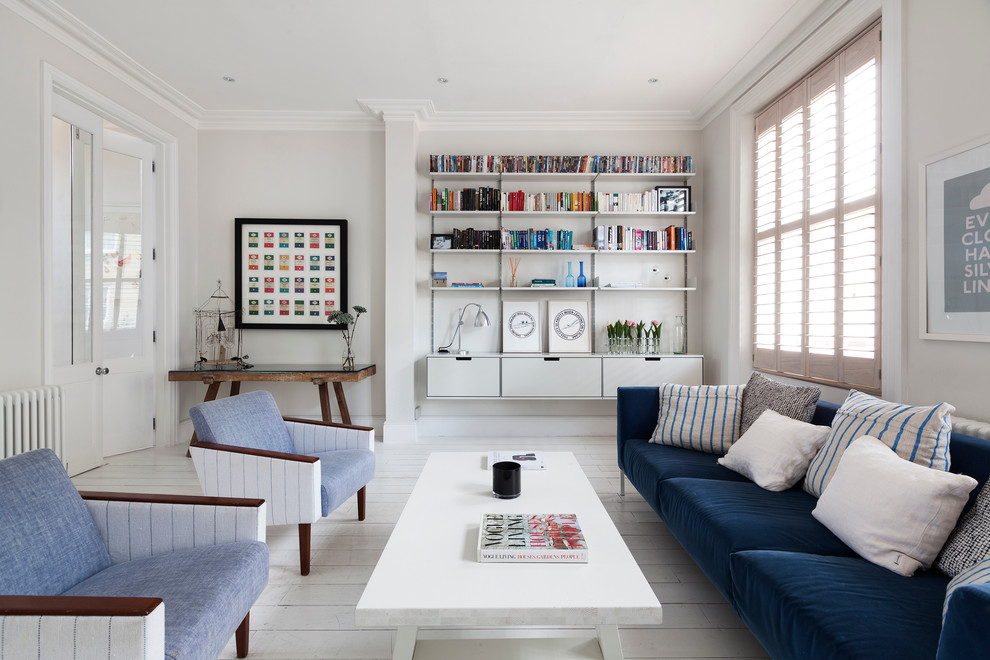 Medium sized contemporary open plan living room in London with white walls.