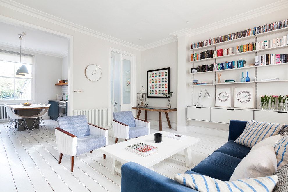 Inspiration for a medium sized scandinavian open plan living room in London with white walls and painted wood flooring.