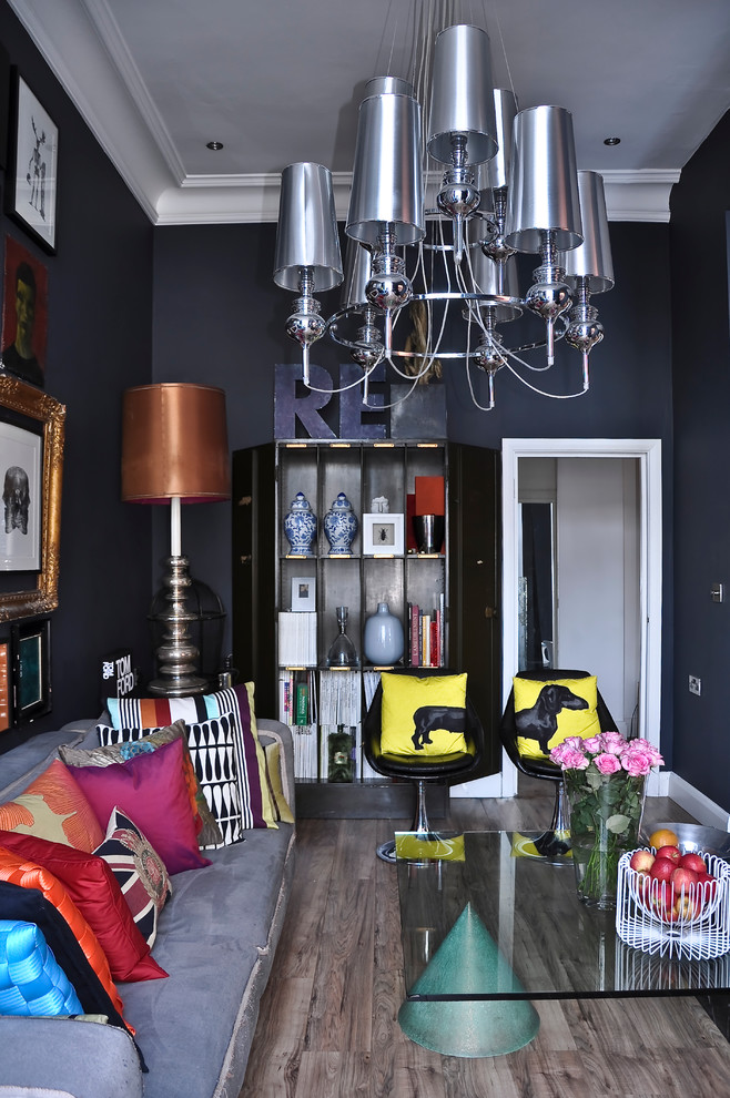 Example of a mid-sized trendy enclosed living room design in London with black walls