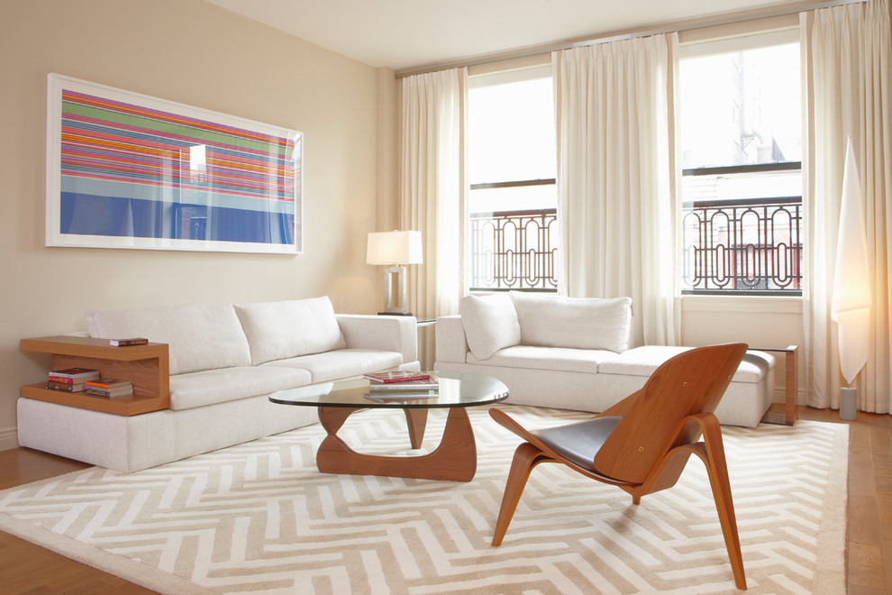 Example of a trendy living room design in New York with beige walls