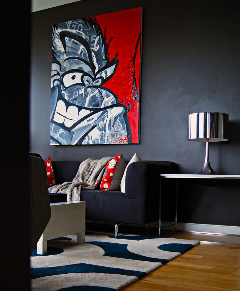 This is an example of a contemporary living room in New York with black walls.