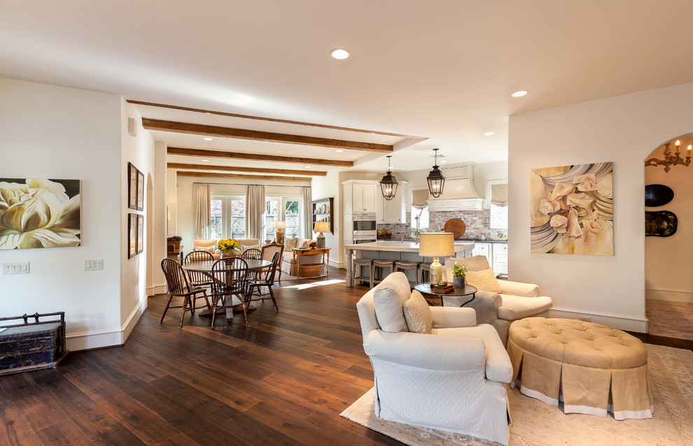 Inspiration for a huge timeless open concept dark wood floor and brown floor living room remodel in Houston with white walls