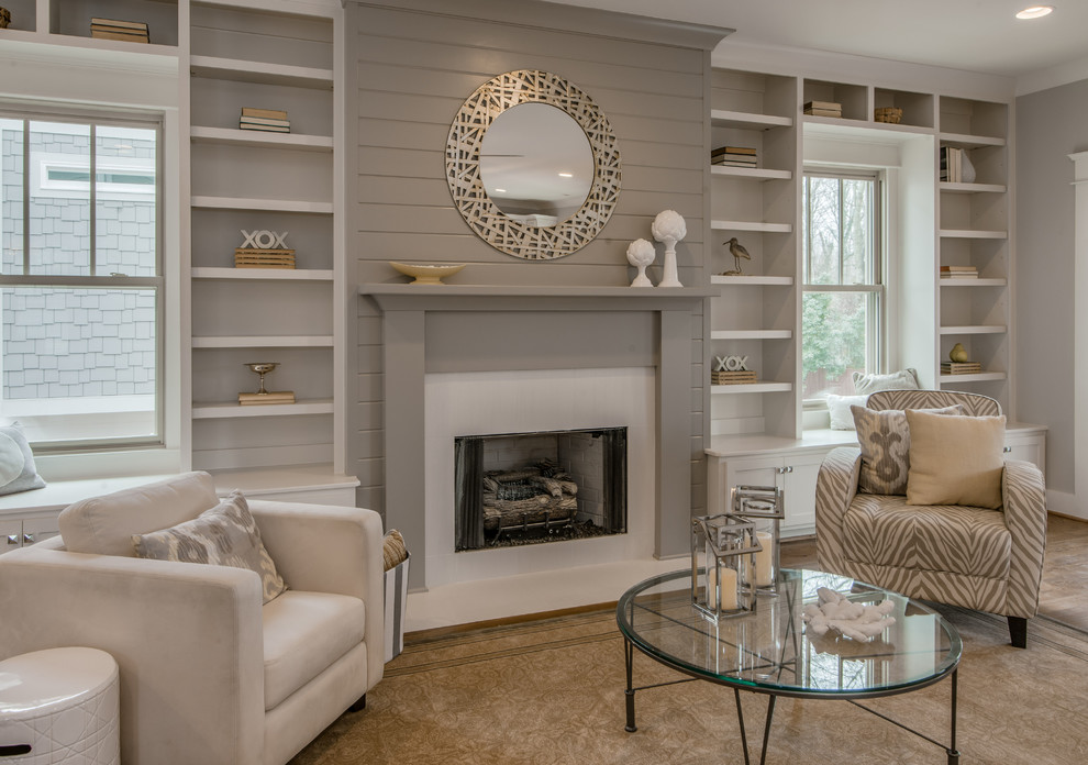 Photo of a medium sized traditional formal open plan living room in Nashville with grey walls, medium hardwood flooring, a standard fireplace and no tv.