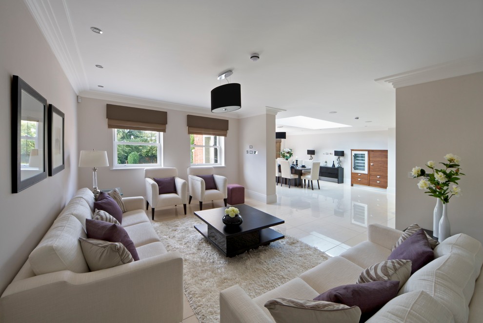Large contemporary open plan living room in Other with porcelain flooring.