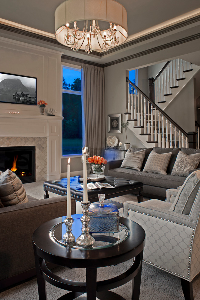 Design ideas for a large traditional formal and grey and white open plan living room in Detroit with grey walls, a standard fireplace, a tiled fireplace surround, a built-in media unit and carpet.