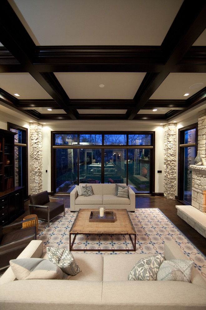 Example of a large trendy formal and open concept dark wood floor living room design in Chicago with beige walls, a standard fireplace, a stone fireplace and a wall-mounted tv