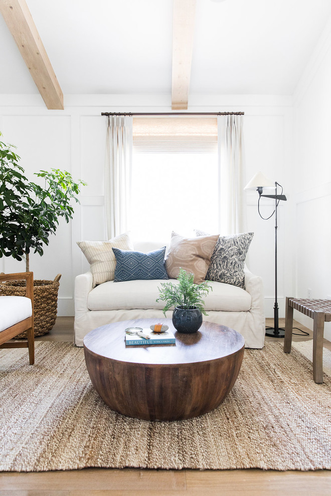Inspiration for a small coastal open concept light wood floor living room remodel in Salt Lake City with white walls
