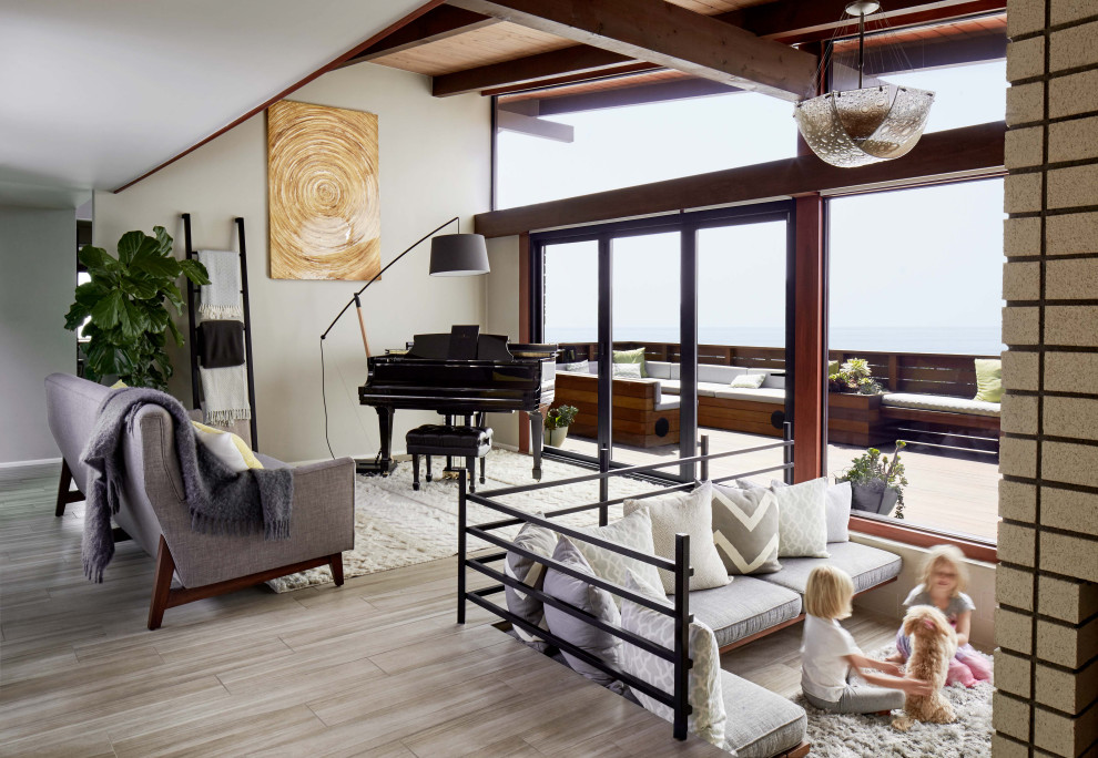 Esempio di un soggiorno moderno aperto con sala della musica, pavimento in gres porcellanato, pareti grigie e pavimento beige