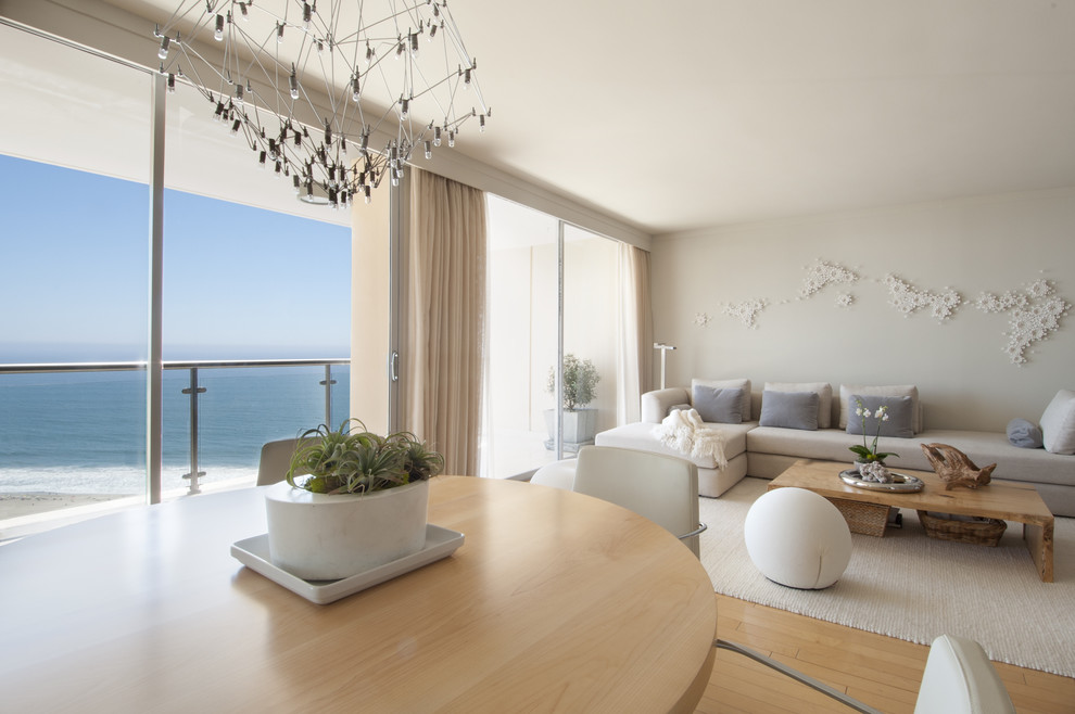 Example of a mid-sized trendy formal and open concept light wood floor living room design in Los Angeles with white walls, no fireplace and no tv