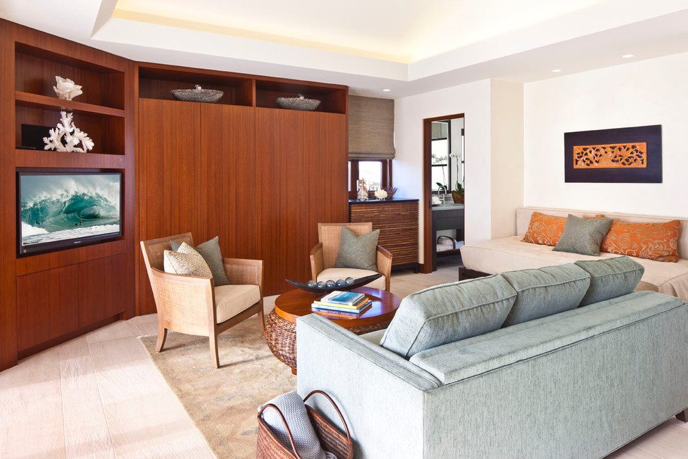 This is an example of a contemporary living room in Orange County with white walls and a built-in media unit.