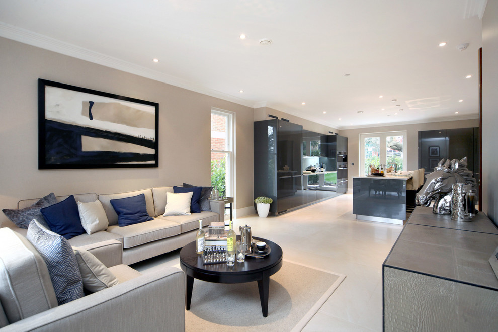 This is an example of a medium sized contemporary grey and cream open plan living room in Buckinghamshire with beige walls and limestone flooring.
