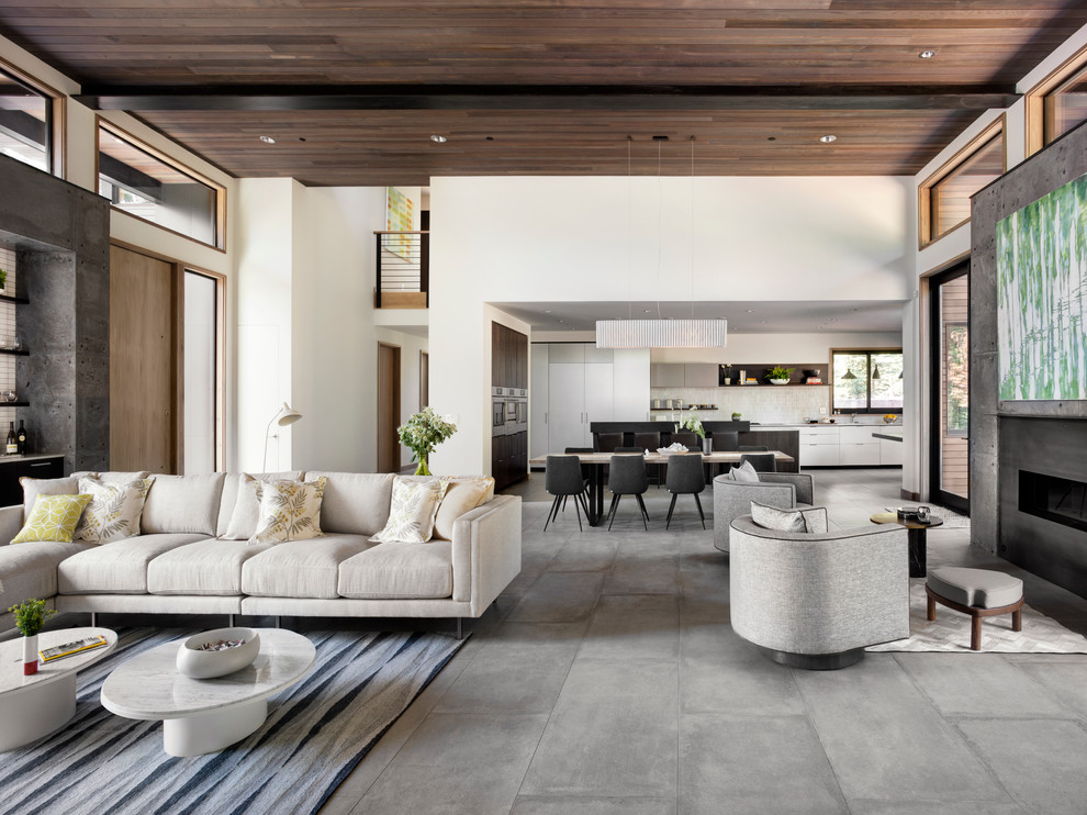 Inspiration for a large modern open concept porcelain tile living room remodel in San Francisco with a bar, white walls, a ribbon fireplace, a concrete fireplace and a wall-mounted tv