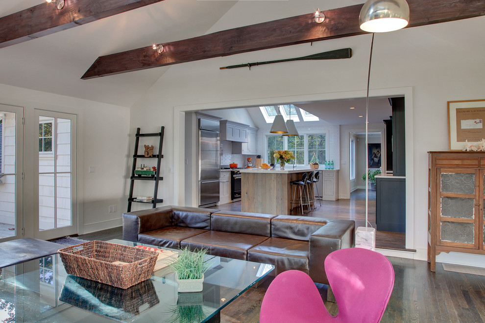Large eclectic open concept dark wood floor living room photo in Bridgeport with white walls, a standard fireplace, a concrete fireplace and a wall-mounted tv