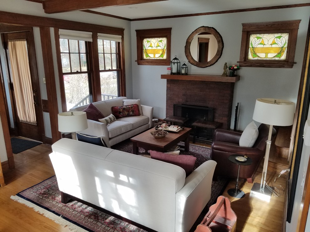 Living room - mid-sized craftsman formal and open concept light wood floor and beige floor living room idea in Chicago with white walls, a standard fireplace, a brick fireplace and no tv