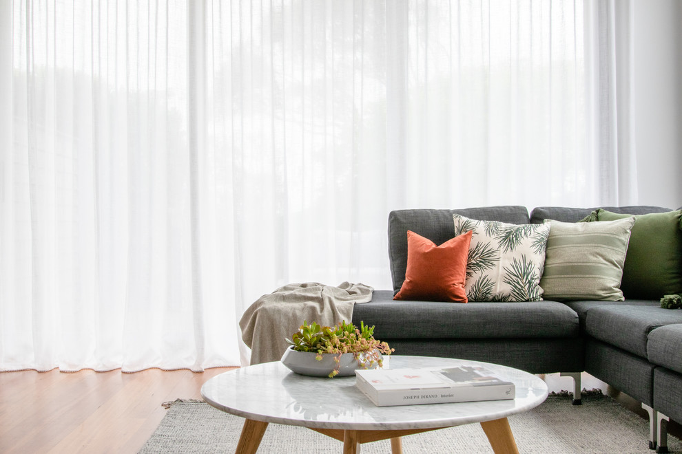 Example of a trendy open concept light wood floor living room design in Sydney
