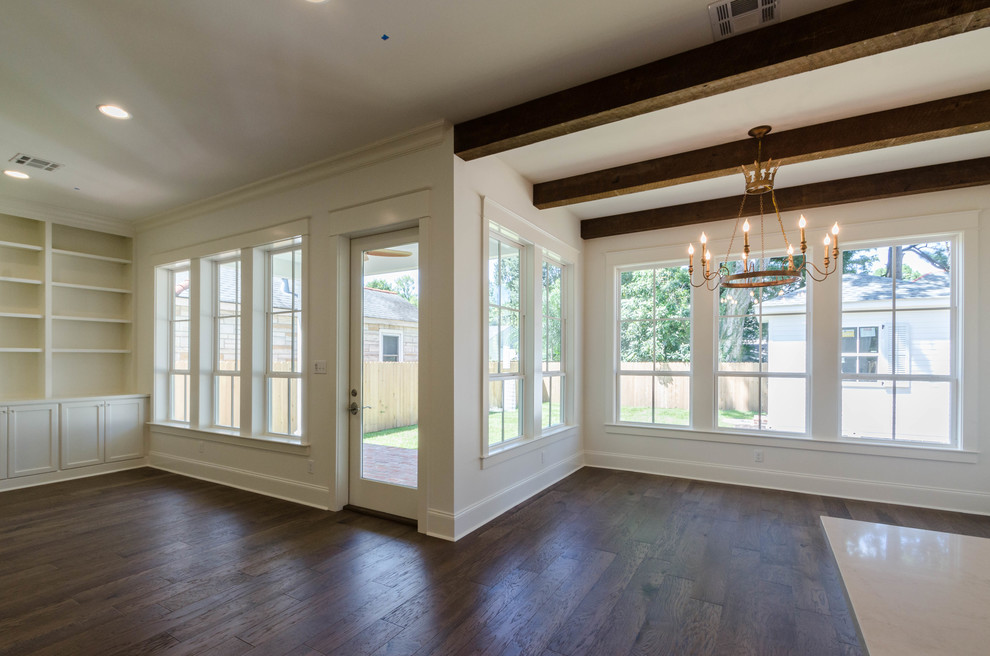 Photo of a large traditional open plan living room in New Orleans with white walls, medium hardwood flooring and no tv.