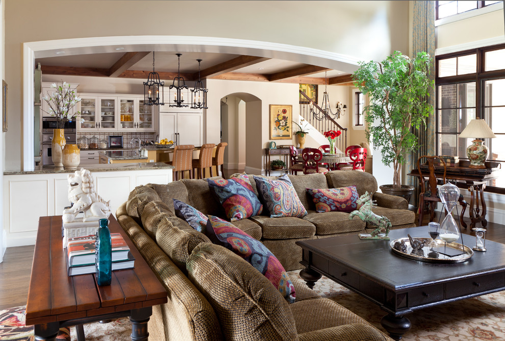 Example of a classic open concept living room design in Denver with beige walls
