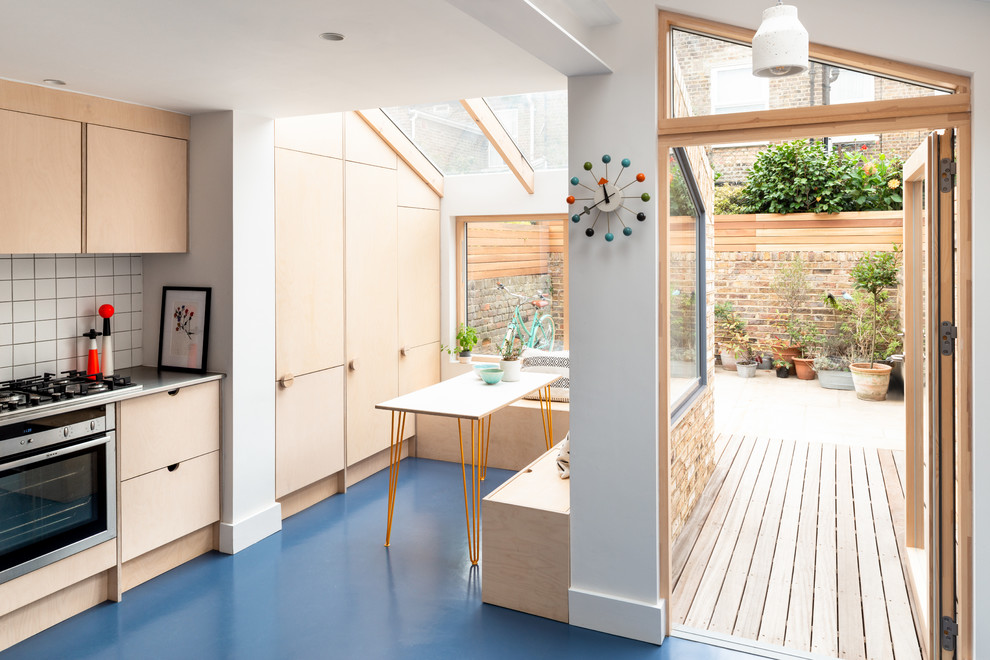 Scandi kitchen in London with blue floors.