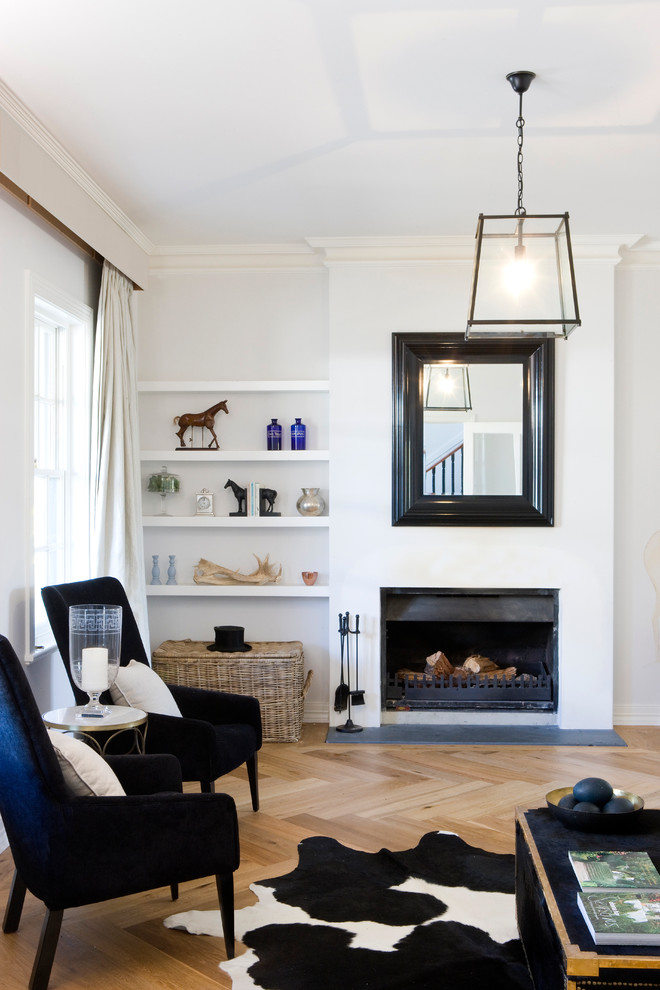 This is an example of a large scandi living room in Adelaide with white walls, light hardwood flooring, a standard fireplace and a plastered fireplace surround.