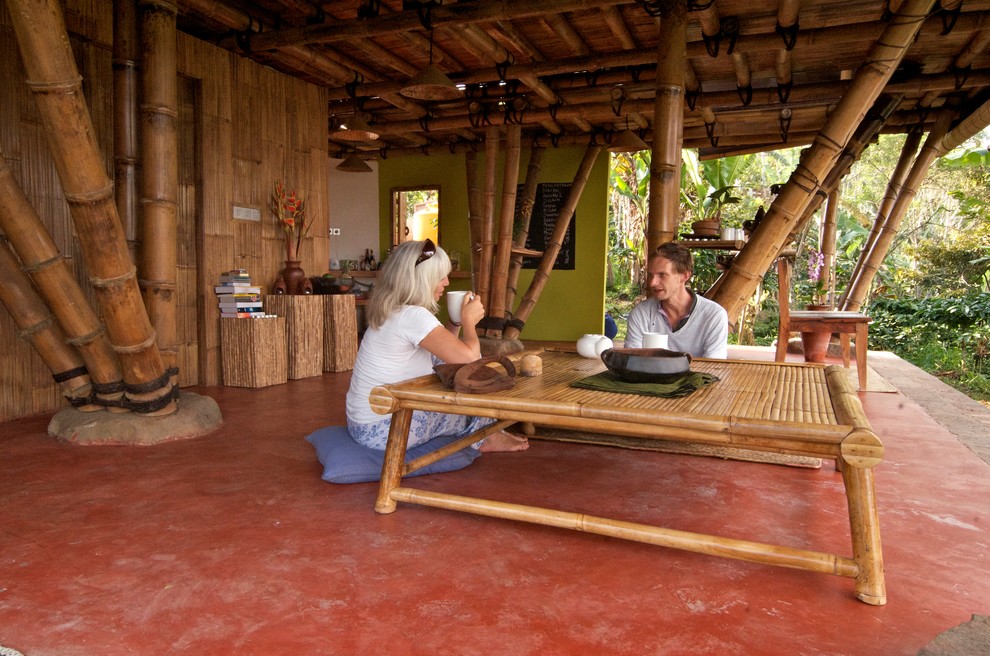 Island style concrete floor living room photo in Adelaide