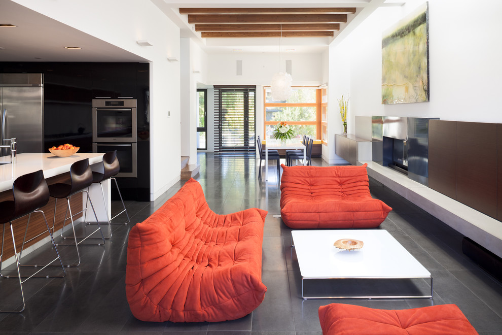 Example of a trendy open concept living room design in Vancouver with white walls