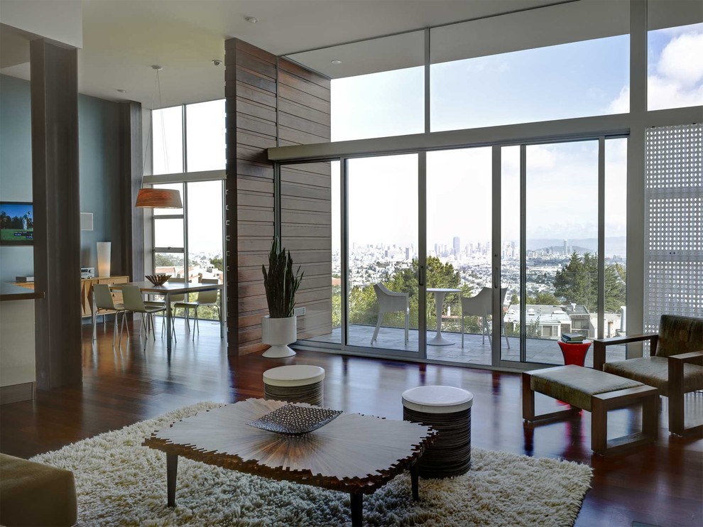 Стильный дизайн: гостиная комната в стиле модернизм с синими стенами - последний тренд