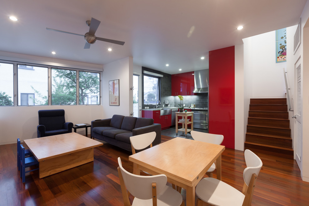 Example of a minimalist living room design in Los Angeles with white walls