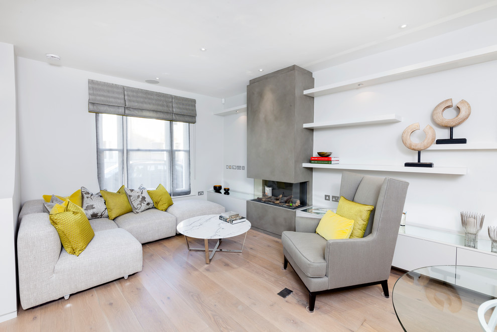 This is an example of a small scandinavian grey and white living room in London.
