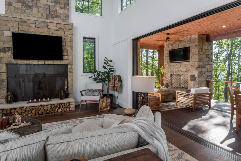 Photo of a medium sized rustic open plan living room in Other with white walls, carpet, no fireplace and grey floors.