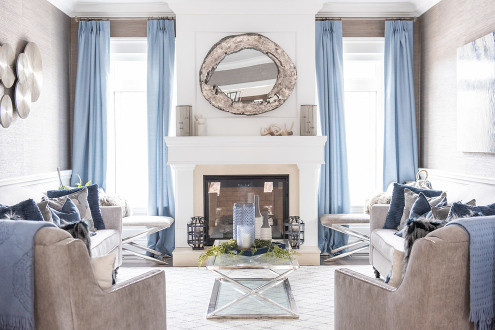 Photo of a large classic formal enclosed living room in Toronto with beige walls, medium hardwood flooring, a standard fireplace, a tiled fireplace surround, no tv and brown floors.