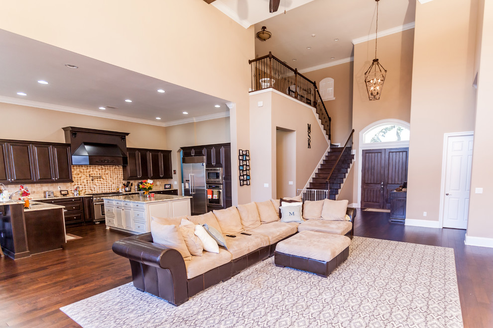Photo of a large mediterranean open plan living room in Jacksonville with medium hardwood flooring.