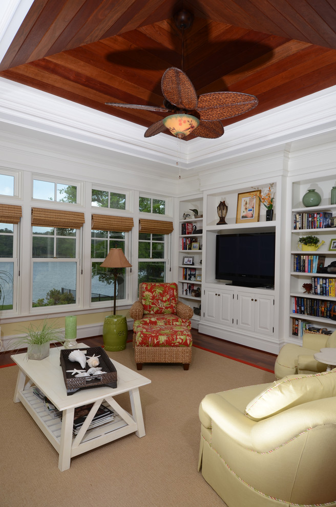 Example of a mid-sized classic dark wood floor living room design in Atlanta with yellow walls and a media wall