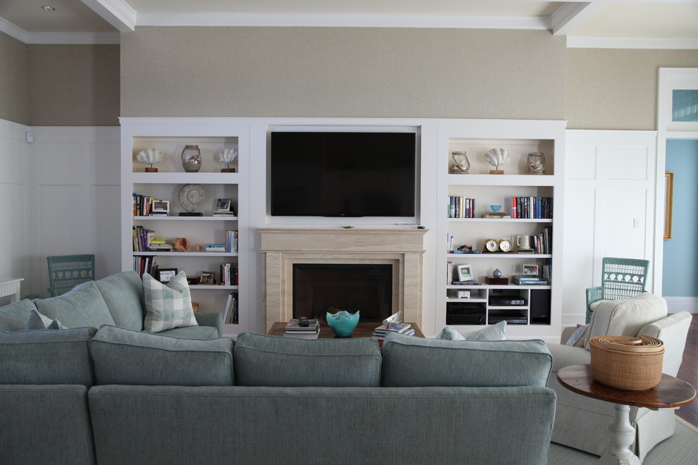 Example of a mid-sized transitional formal and enclosed medium tone wood floor living room design in Boston with beige walls, a standard fireplace, a stone fireplace and a wall-mounted tv
