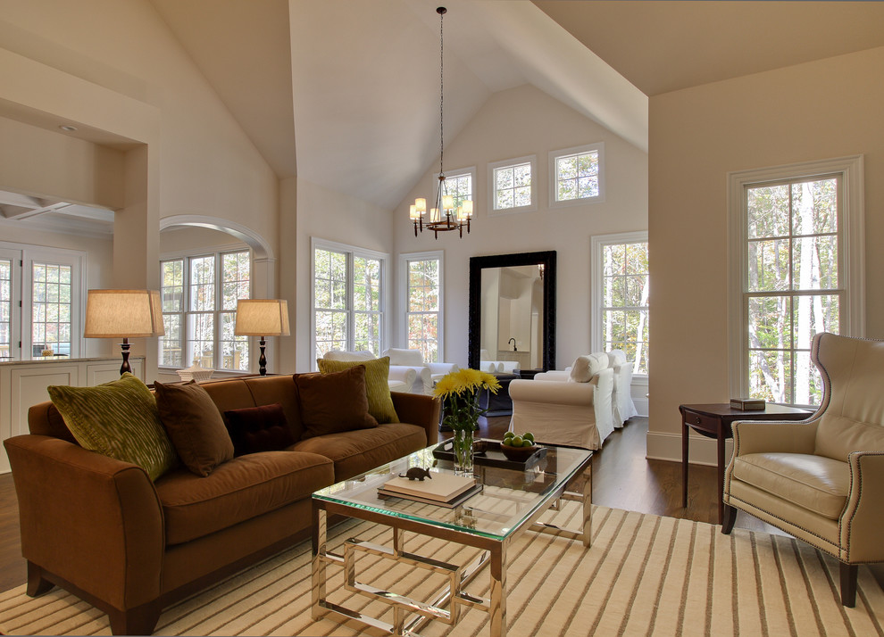 Design ideas for a contemporary living room in Raleigh with beige walls and dark hardwood flooring.