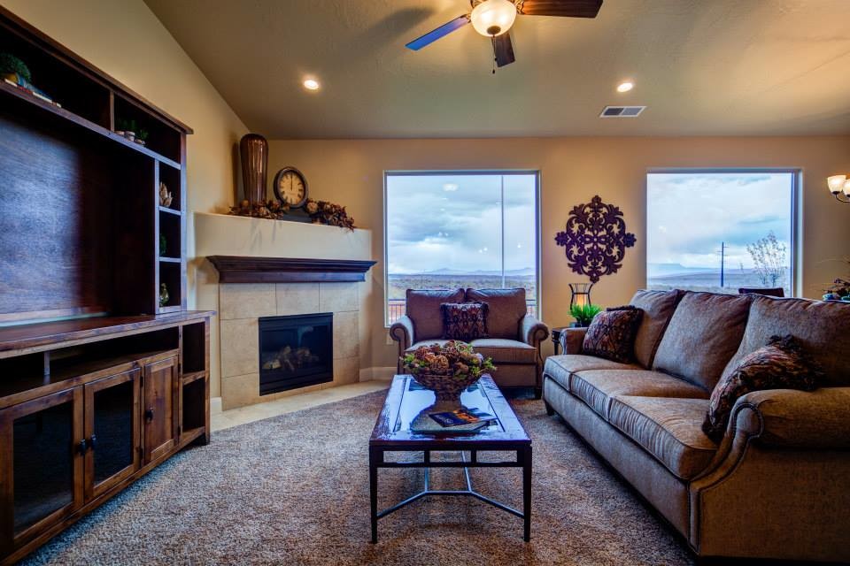 Example of a large ceramic tile living room design in Salt Lake City with beige walls