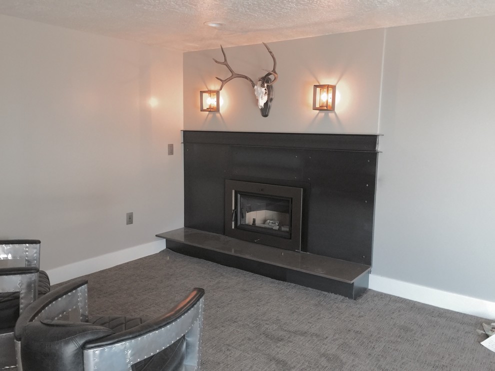 Example of a mid-sized urban formal and enclosed carpeted and beige floor living room design in Salt Lake City with gray walls, a standard fireplace, a metal fireplace and no tv