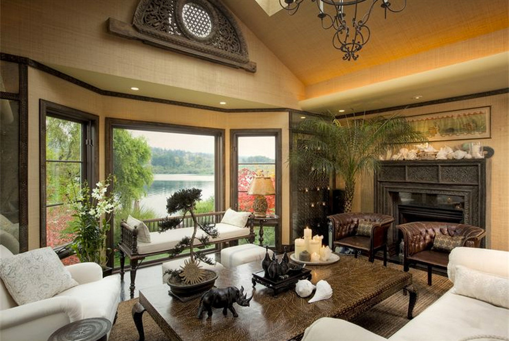 Photo of a large traditional formal enclosed living room in Seattle with brown walls, dark hardwood flooring, no tv, brown floors and a standard fireplace.