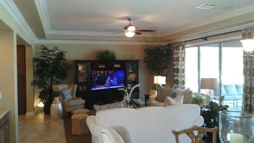 Open concept painted wood floor living room photo in Las Vegas with beige walls, no fireplace and a media wall