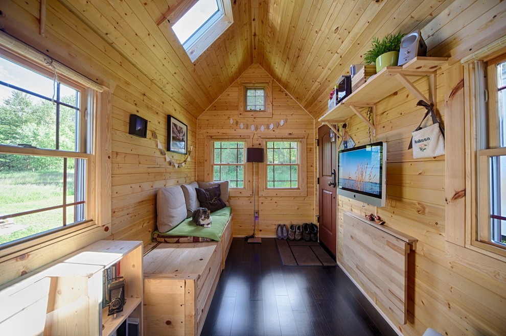 Example of a small mountain style living room design in Seattle with a wall-mounted tv