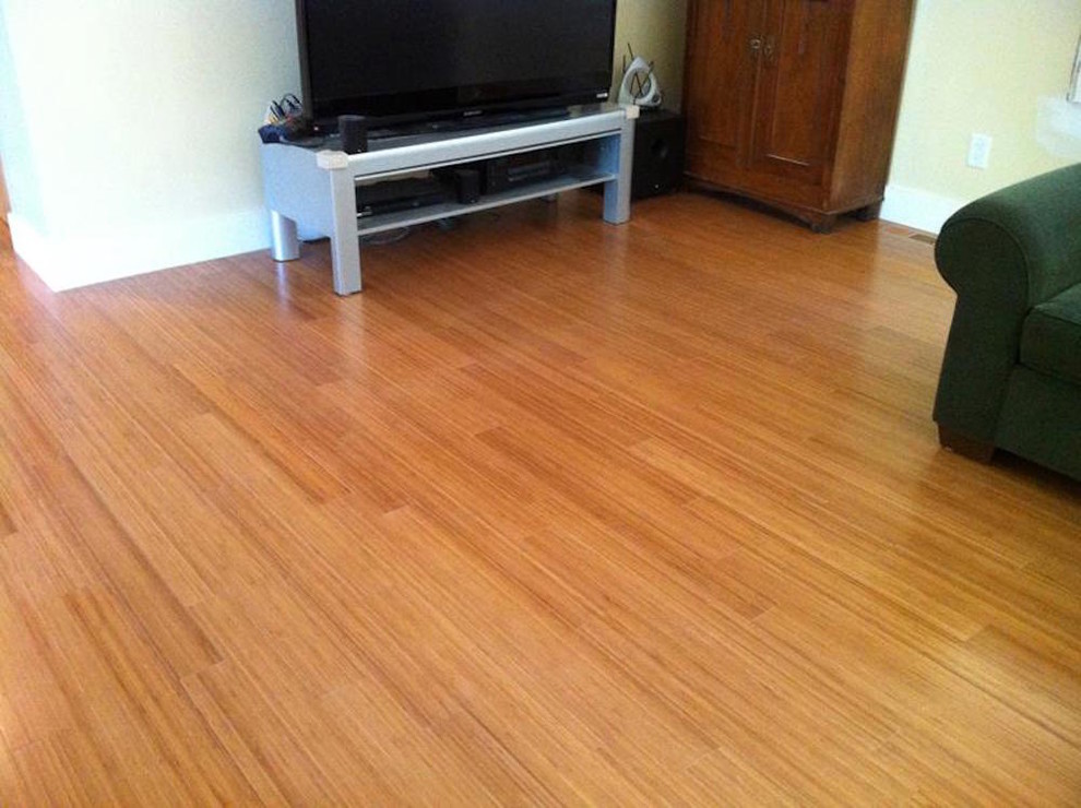 Photo of a living room in Atlanta with beige walls and bamboo flooring.