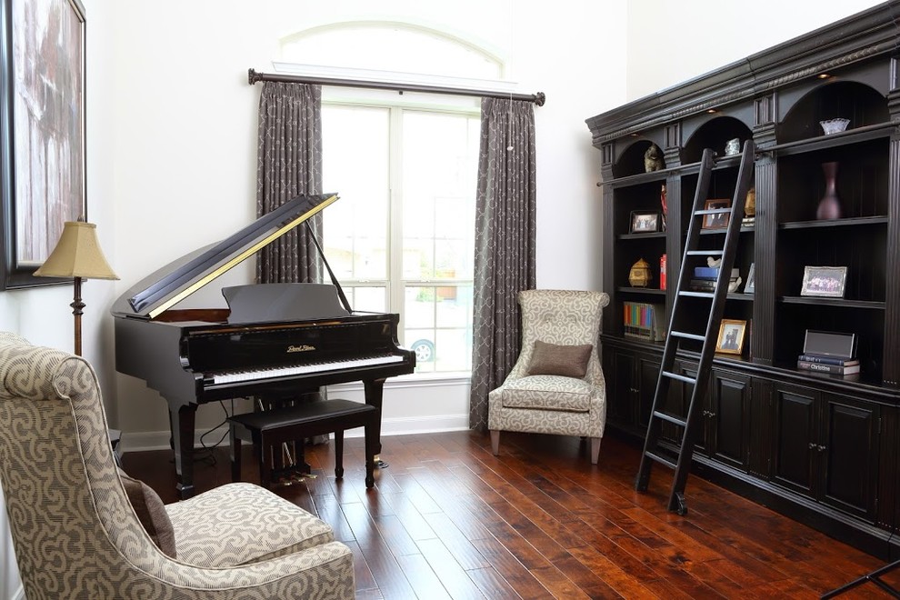 Inspiration for a mid-sized victorian enclosed medium tone wood floor and brown floor living room remodel in Houston with a music area, white walls, no fireplace and no tv