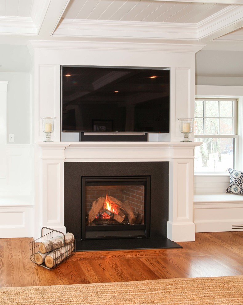 Photo of an expansive classic formal open plan living room in Other with grey walls, medium hardwood flooring, a standard fireplace and a built-in media unit.