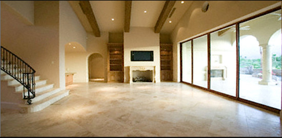 Large elegant limestone floor living room photo in San Diego