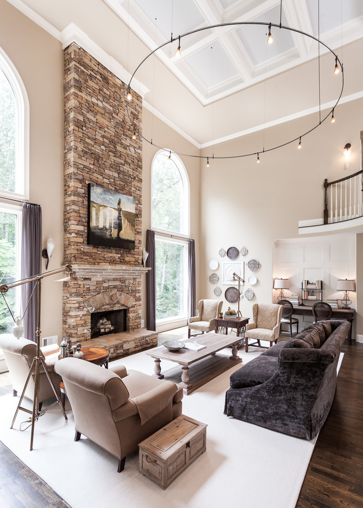 Large transitional formal and open concept dark wood floor and brown floor living room photo in Atlanta with beige walls, a standard fireplace, a stone fireplace and no tv