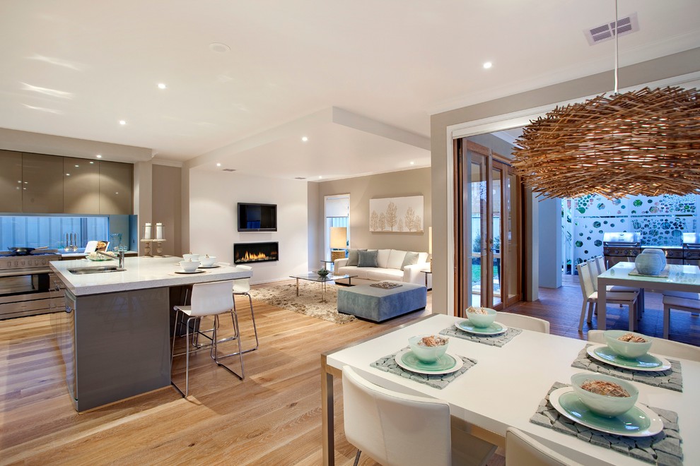 Trendy living room photo in Melbourne with white walls
