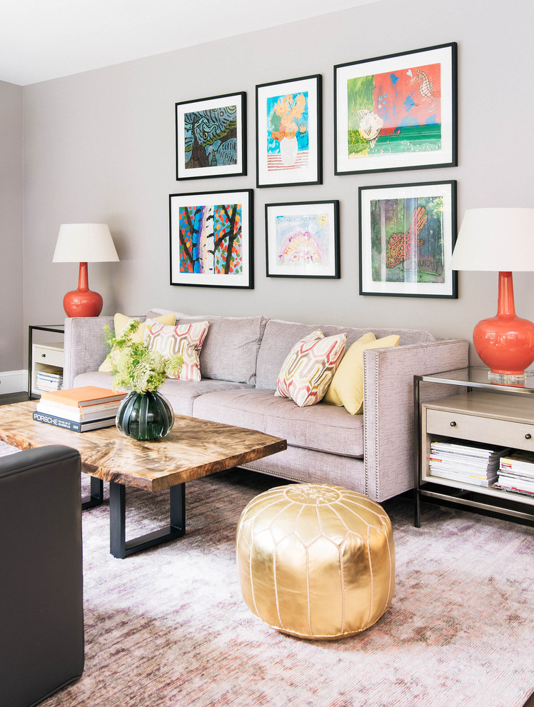 Inspiration for a mid-sized transitional open concept medium tone wood floor and brown floor living room remodel in Toronto with gray walls, a standard fireplace, a stone fireplace and a wall-mounted tv