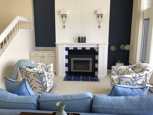 Inspiration for a medium sized coastal formal open plan living room in Other with beige walls, carpet, a standard fireplace, a wooden fireplace surround, no tv and brown floors.
